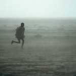 Ethiopian Refugee Running in Rainstorm