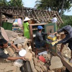 Indonesian residents salvage belongings